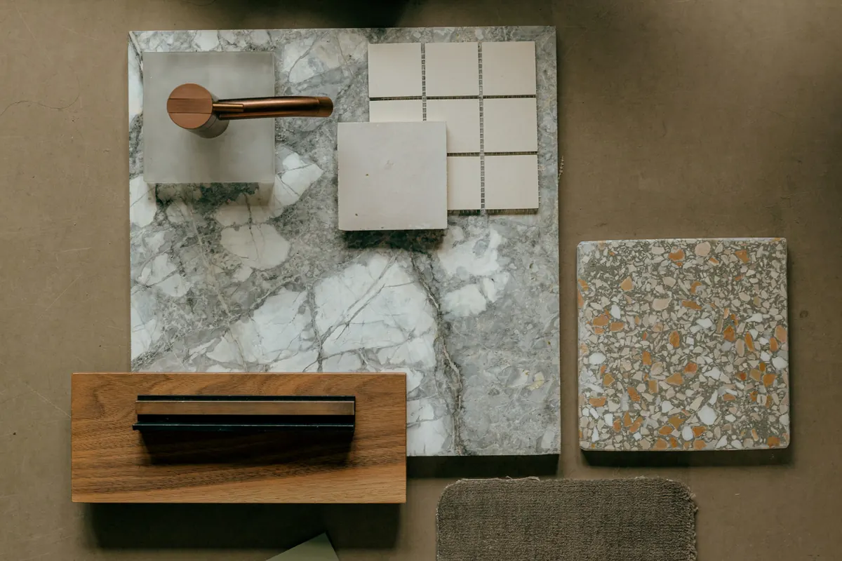 Leather, marble, timber, terrazzo and painted samples laid out together